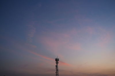 Low angle view of tower against sky during sunset