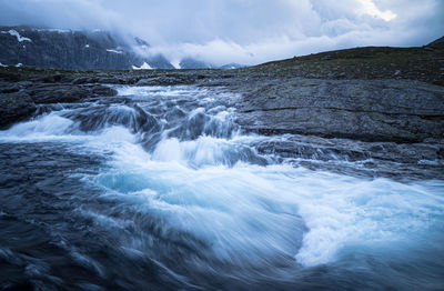 Wild river flowing through a mountain area in hardangervidda, norway.