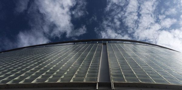 Low angle view of building against cloudy sky