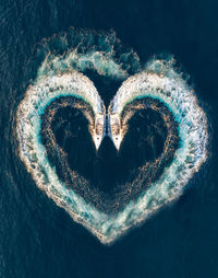 High angle view of heart shape over sea