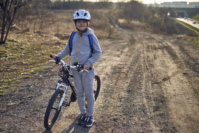 Portrait of boy riding bicycle