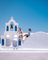 Rear view of woman walking on snow