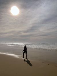 Full length of man on beach against sky