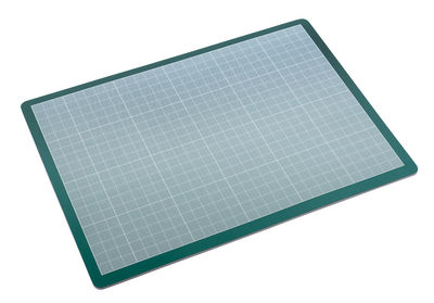 High angle view of cutting mat against white background