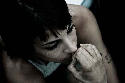 Close-up of young woman with hands