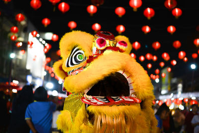 Person in costume during chinese new year at night