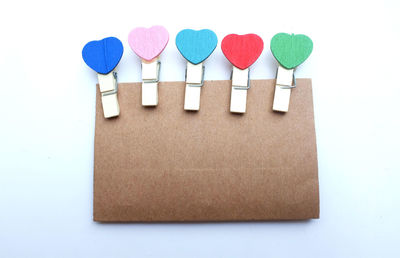 Colorful wood paper clip heart set isolate on white background.