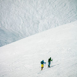 High angle view of people skiing on snow