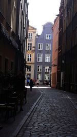 Street amidst buildings in city against sky