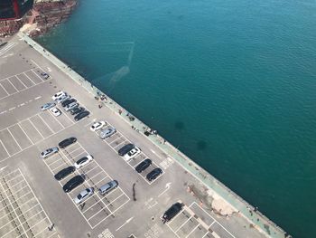 High angle view of buildings by sea in city