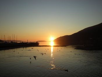 Scenic view of sea against sky during sunset