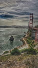 Bridge over sea against sky