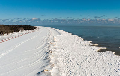 Scenic view of sea against sky during winter