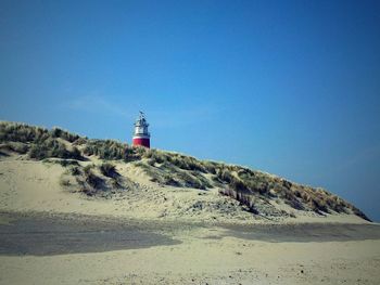 Lighthouse against blue sky