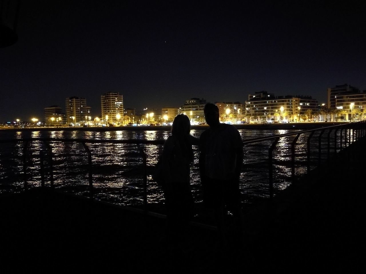 night, illuminated, city, water, cityscape, lifestyles, leisure activity, city life, river, skyscraper, urban skyline, sky, outdoors, dark, modern