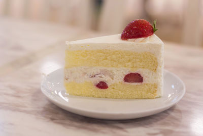 Close-up of cake in plate on table