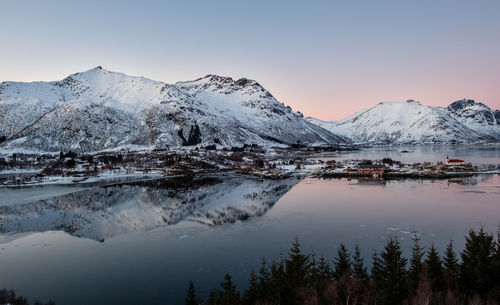 Scenic view of frozen lake against sky during winter