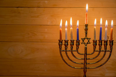 High angle view of illuminated candles on table
