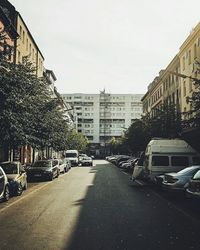 Cars parked on road in city