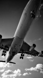 Low angle view of airplane flying in sky