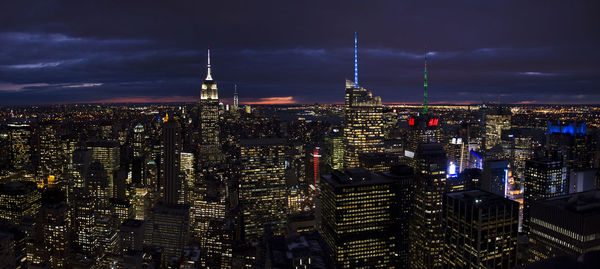 Illuminated buildings in city at night