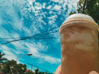 Close-up of drink against blue sky