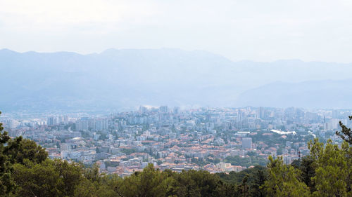 High angle view of buildings in city against sky