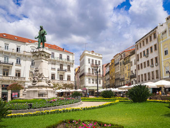 View of buildings against cloudy sky