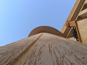 Low angle view of built structure against blue sky