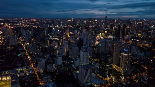 High angle view of illuminated city buildings at night