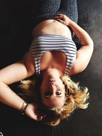 High angle view portrait of woman lying down