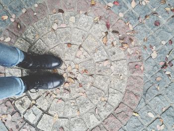 Low section of a man standing on ground