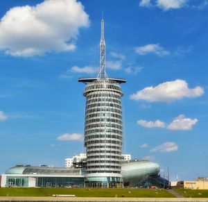 Low angle view of building against cloudy sky