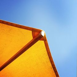 Low angle view of built structure against clear blue sky