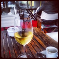 Close-up of wine glasses on table