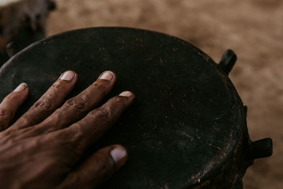 High angle view of hand on a drum