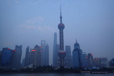 Modern buildings in city against sky