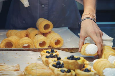 Midsection of man preparing food