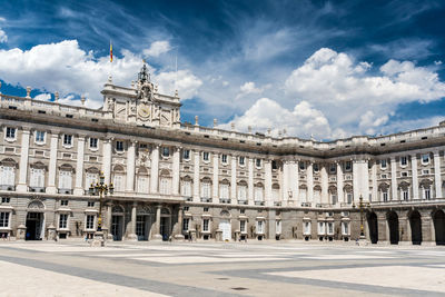 Low angle view of historic building against cloudy sky