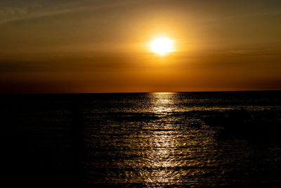 Scenic view of sea against romantic sky at sunset