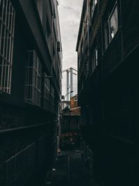 Narrow alley amidst buildings in city