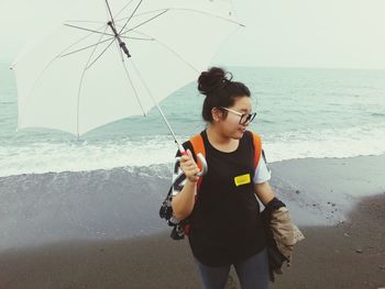 Woman standing on beach