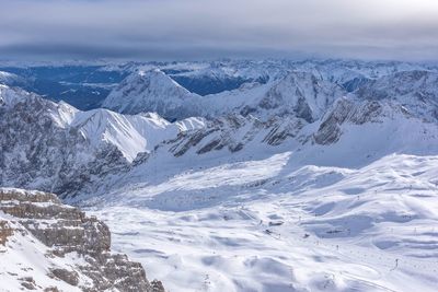 Scenic view of snow mountains against sky