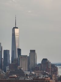 Modern buildings in city against sky