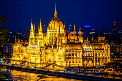 Illuminated buildings in city at night