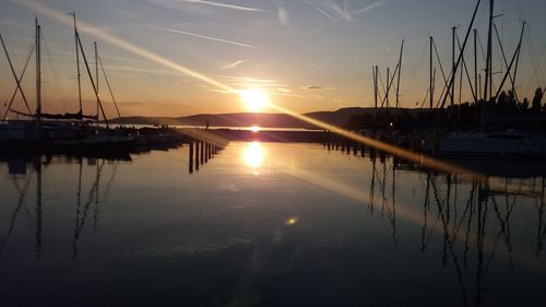 Silhouette of marina at sunset