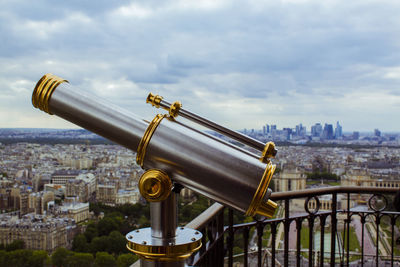 Cityscape against cloudy sky