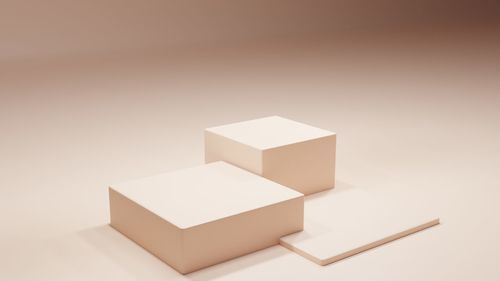 High angle view of piano keys on white background