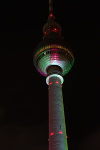 Low angle view of illuminated lights at night