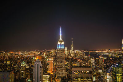 Illuminated buildings in city at night